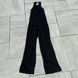 NWT. Holiday - Jumpsuit. Lace and Crepe material jumpsuit.